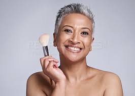 makeup and brush with senior woman
