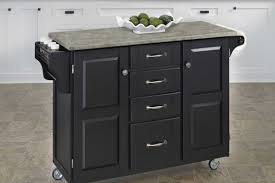 Nantucket black kitchen island with granite top nantucket kitchen island is constructed of nantucket kitchen island is constructed of hardwood solids and engineered woods in a sanded and distressed black finish for an aged worn look. 8 Portable Islands To Turn Your Kitchen Into A Moveable Feast