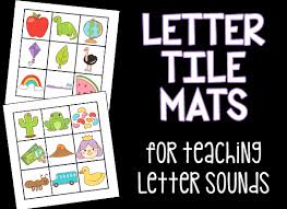 Some colourful printable mats with the alphabet in an arc above a rainbow. Letter Tile Mats Free Printables Prekinders