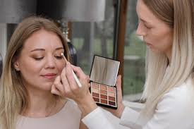 premium photo makeup artist applying