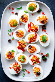 This healthier deviled eggs recipe is made using greek yogurt, mustard, and lemon juice. Spicy Deviled Eggs Healthy Seasonal Recipes