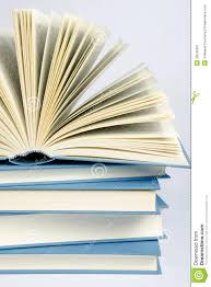 A Stack Of Blue Books On Light Blue Background Stock Image