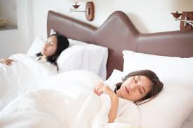 two asian women sleeping