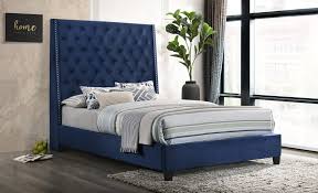 blue velvet upholstered queen bed