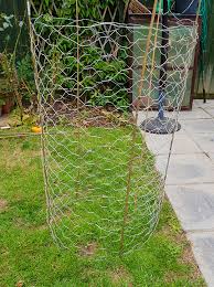 Wrap the bottom exposed 4 feet of the enclosure in chicken wire or mesh, securing with staples. How To Make Tomato Cages With Chicken Wire Wire Fence