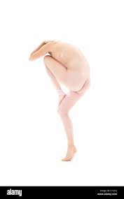 Naked gymnastic model making forms with her posture Stock Photo 