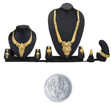 2 golden jewellery sets with kada