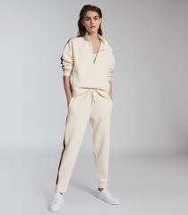 Shop women's loungewear & comfy clothes at aerie to find all the loungewear, sleepwear, and comfy clothes you need! Libby Ivory Side Stripe Loungewear Zip Through Reiss