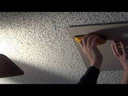 a stud finder on a textured ceiling