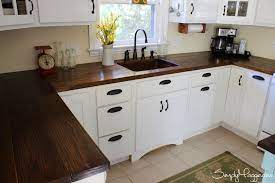 Whether you're going for oak, walnut or another wood, the natural surfaces will add a beautiful warmth to your kitchen. Diy Wide Plank Butcher Block Counter Tops Simplymaggie Com