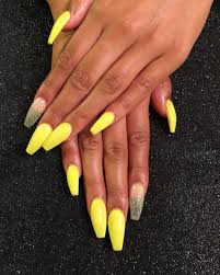 The yellow color is one of the colors that are in trend this spring summer season, this color can be used to make your nails to be trendy and stylish this season because the bow is the perfect fashion accessory see the collection of cool yellow acrylic nail design ideas that have chosen just for you. Bright Yellow Coffin Nails With A Custom Glitter Mix Accent Nails Acrylicnails Naildesign Nail Designs Summer Acrylic Coffin Nails Long Bright Nail Designs
