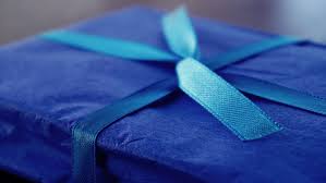 blue wrapped birthday present with bow