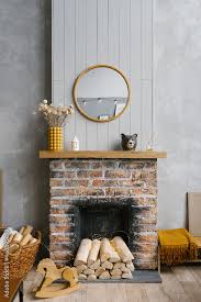 Scandinavian Brick Fireplace With Wood