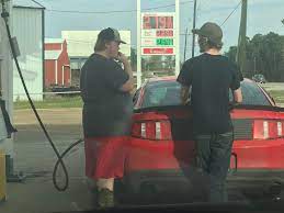 this guy smoking while pumping gas with