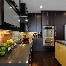This kitchen contrasts with the other rooms in this the black kitchen set and cabinet are combined with the wooden rack, creating a unique kitchen. Photos Hgtv
