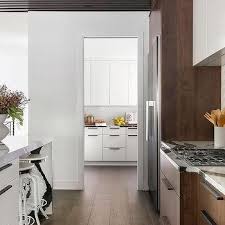 white kitchen cabinets dark wood floors