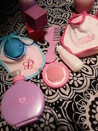 baby doll care accessories in bag