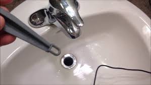 how to remove a bathroom sink stopper