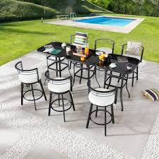 outdoor dining set with beige cushions