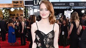 emma stone gets a perm with her makeup
