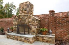 Slate Fireplace With Brick Wall Backdrop