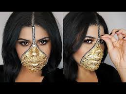 zipper face makeup using gold leaf