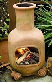 5000 gel fuel natural gas propane wood wood pellets all deals sale chimineas fire columns fire pits fire tables ground fire rings outdoor fireplaces buy online & pick up. Terracotta Chiminea With Wood Fire On Patio Fire Pots Chiminea Outdoor Cooking Stove