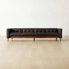 4 seater tufted black leather sofa