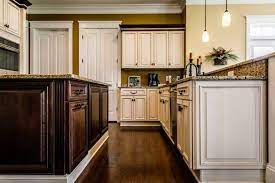 Apply your primer to each cabinet and door with a roller and brush. Painted Vs Stained Cabinets