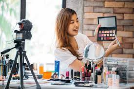 pretty asian woman recording makeup