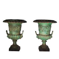 green painted cast iron garden urns