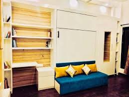wall mounted bed with sofa and wardrobe