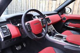 white range rover with red interior