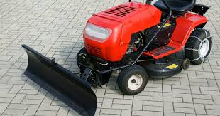 Snow Plow Blade On A Lawn Or Garden Tractor