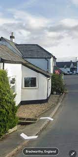 In Google Maps, find the Bradworthy Inn in Holsworthy. In Google Street  View, go left of it to the house for sale. Look in the window. Post  screenshot when you find it.