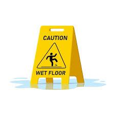 wet floor caution sign and water puddle