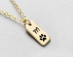 Custom pet gifts advertises a pet photo necklace on instagram, which you can have made at petsmerch.com. Amazon Com Personalized Dog Paw Print Initial Necklace Or Loss Of Pet Memorial Gift Dog Walker Gift Furbaby Necklace Cat Or Dog Pawprint Jewelry Handmade