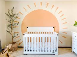 colorful boy nursery with wallpaper and