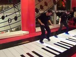 professional dance on giant floor piano