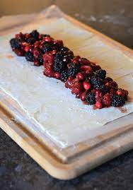 mixed berry strudel with vanilla sauce