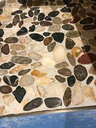 sealing of porous pebbles tiles prior