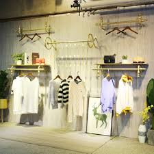 Customers can easily view all the items on opt for a rail smaller in length or height to hang children's clothing. Clothing Store Display Racks On The Wall Men S And Women S Clothing Children S Clothing Store Display Racks Hangers On The Wall Hanging On The Wall Clothes Rail Wall Mounted
