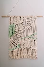 macrame wall hanging with vine and leaf