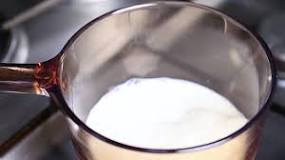 How do you heat milk on the stove without boiling it?