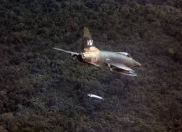 A F-100D aircraft dropping a napalm bomb near Bien Hoa, South Vietnam
