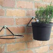 two plant pot ring mounted on the wall