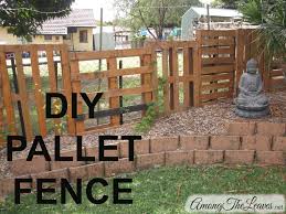 diy pallet fence among the leaves