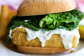 long john silver s fish fry a vegan fish sandwich with tarter sauce and lettuce on it