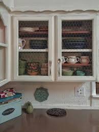 This is also a good way to give existing kitchen cabinets a rustic update. Farmhouse Kitchen Distressed Cabinets Open Shelving Chicken Wire Fork And Spoon H Trendy Farmhouse Kitchen Farmhouse Kitchen Diy Diy Kitchen Renovation