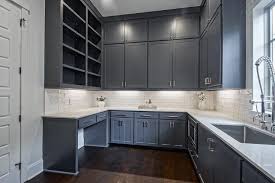 Overall, there's a lot of visual interest in this kitchen. Dark Gray Blue Stacked Pantry Cabinets With White Quartz Countertop Transitional Kitchen